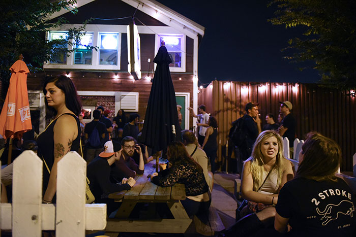 Patrons enjoy the outside seating area on a Saturday night at the Hideout in Chicago, July 15, 2017 ©2017 Alex Garcia